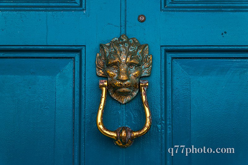 Brass lion head knocker, knocker on blue wooden door, decorative