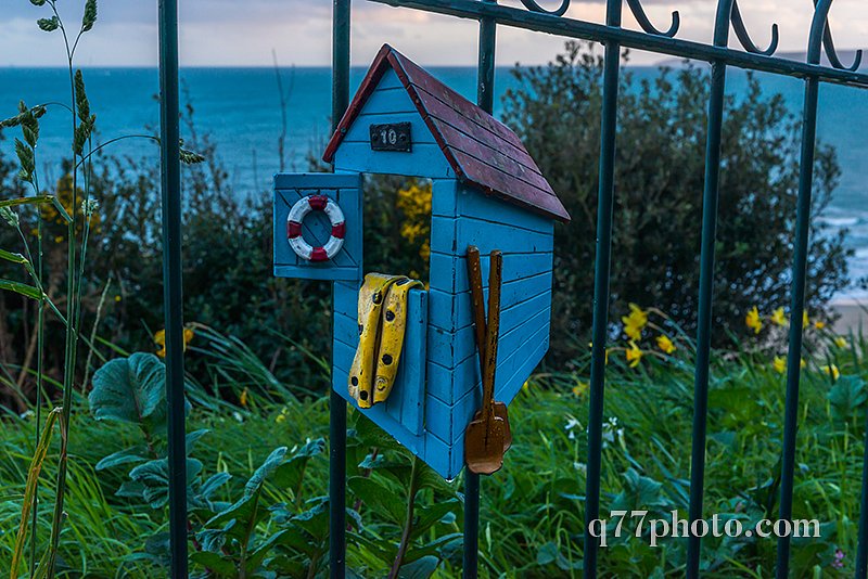 Metal ornament on a balustrade in a coastal town, a symbolic ele