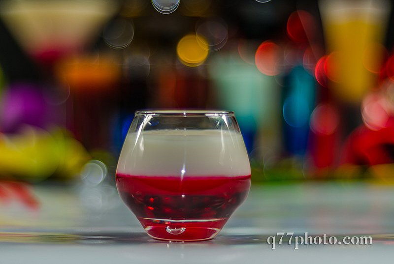 colored drink in glass for shots, a combination of white with re