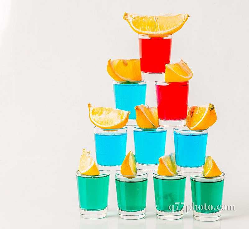 Glasses with blue, green and red kamikaze, glamorous drinks, mix