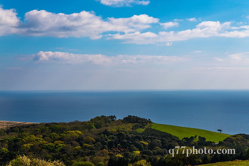 Ocean view with hills, green vegetation background and beautiful