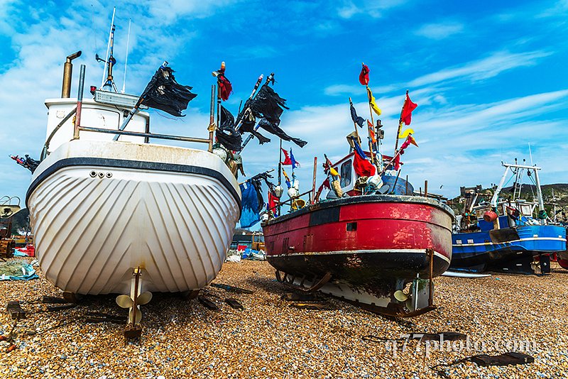 Fishing boats on the shore, pebble beach, wooden boats, fishing 