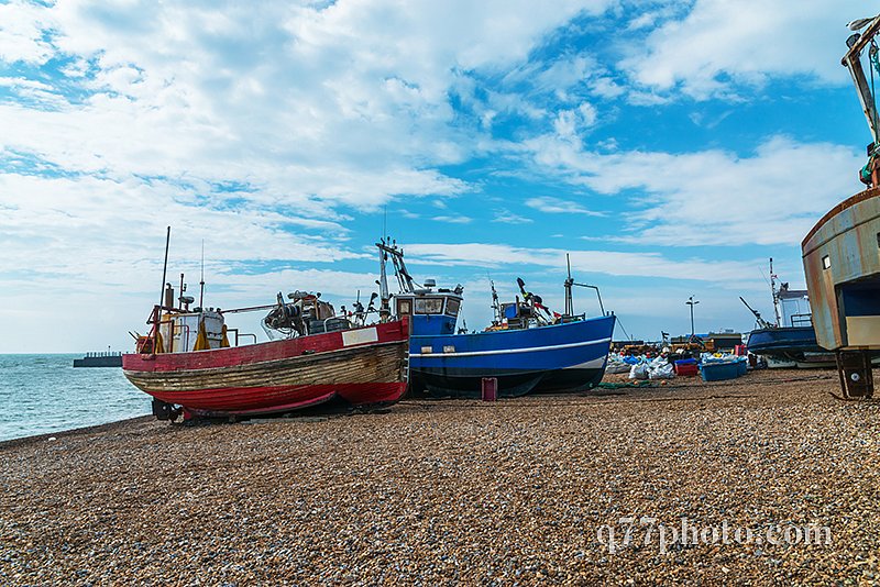 Fishing boats on the shore, pebble beach, wooden boats, fishing 